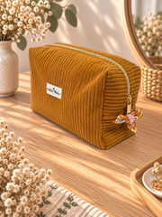 Trousse de toilette Pâquerettes en velours moutarde, vue de côté