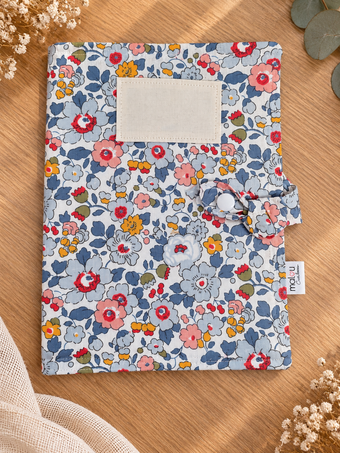 Détail du protège carnet de santé Blue Garden